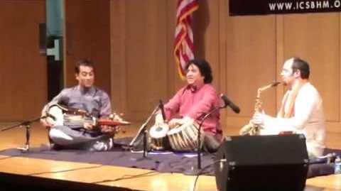 Jesse Bannister, Dr. Rajeeb Chakraborty and Pt. Subhen Chatterjee, sat playing at the Birmingham Museum of Art