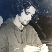A black and white photograph of a very young Jesse on the train.