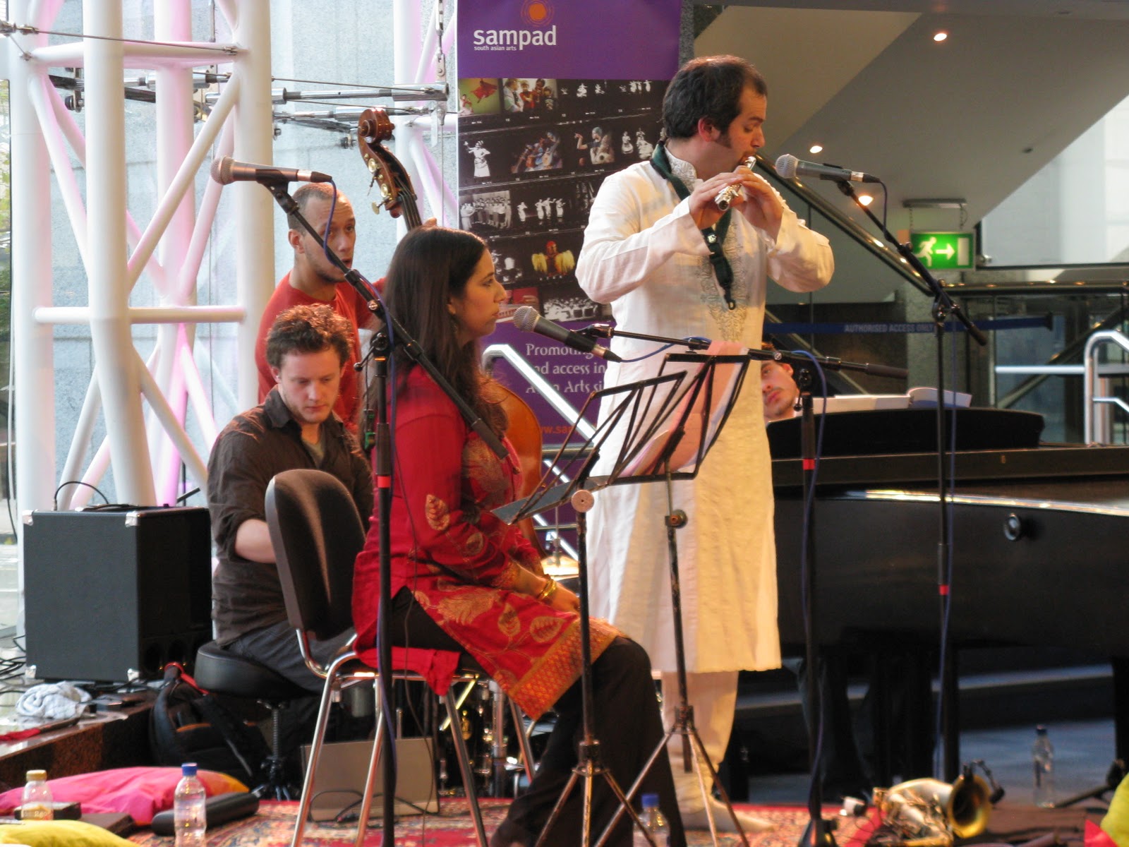 Jesse stood in an all white Punjabi suit with Ranjana Ghatak in the foreground.
