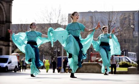 3 dancers in indian dress dancing outside for Luminosity