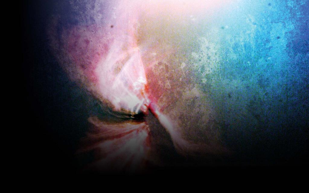 An overexposed image of a dancers dress which includes a gradation from pink to blue.